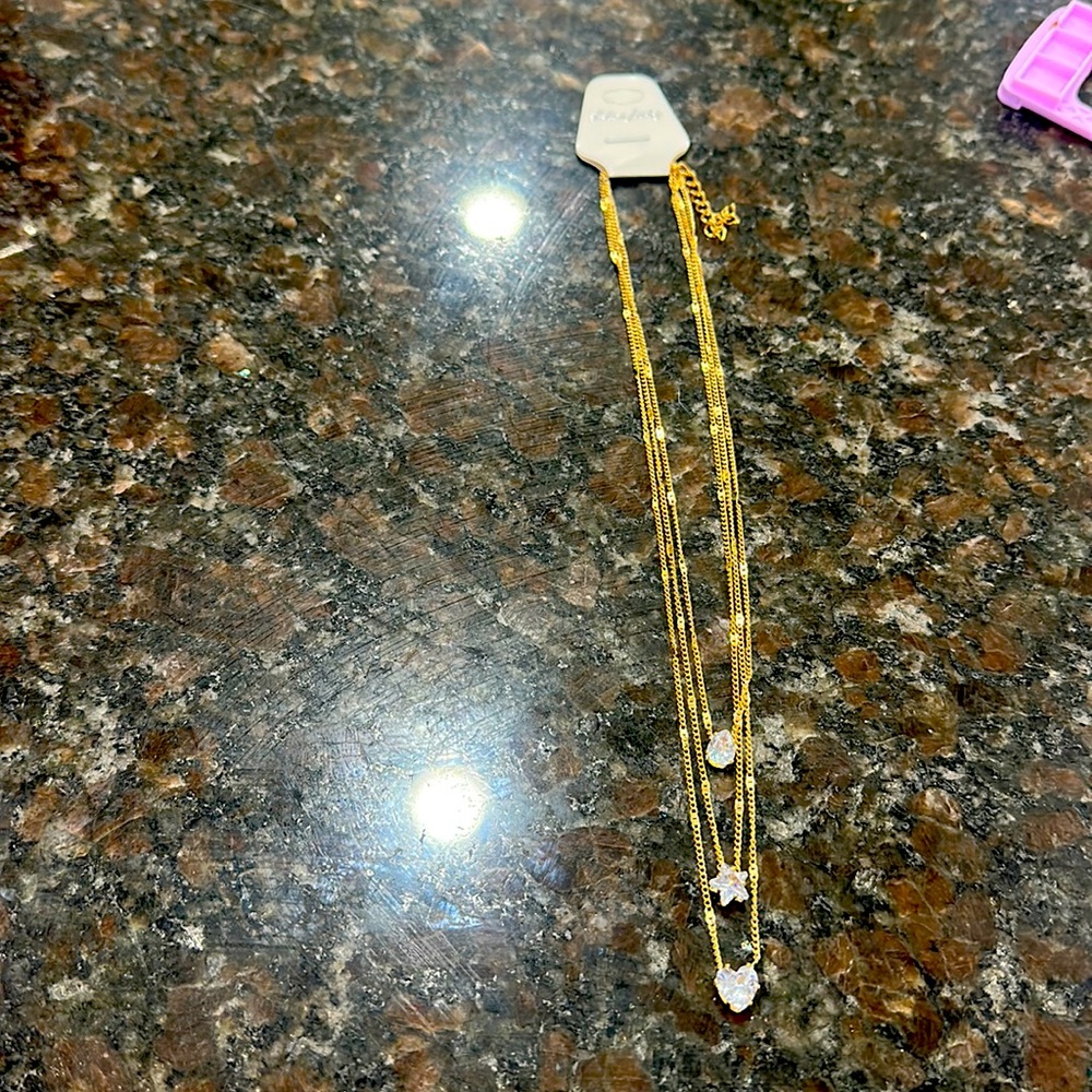 Three chain necklace. Gold with oval, star and heart stones